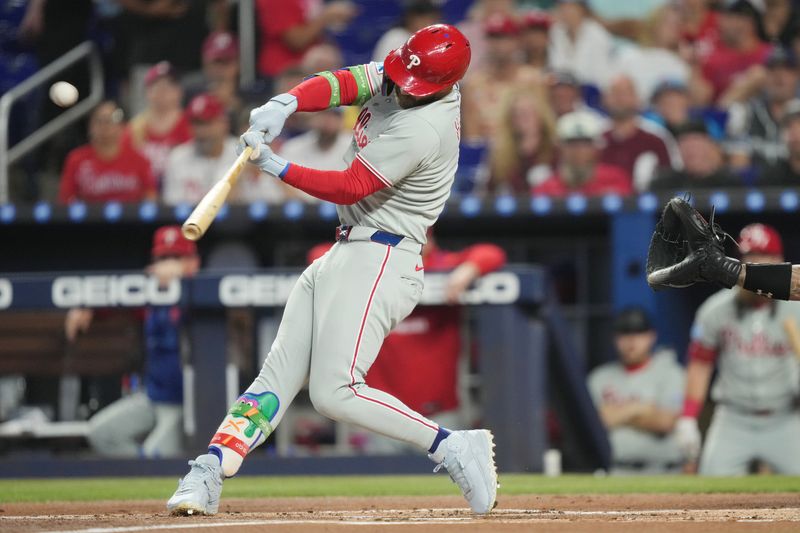 Sep 6, 2025; Miami, Florida, USA;  Philadelphia Phillies first baseman Bryce Harper (3) hits a two-run home run in the first inning against the Miami Marlins at loanDepot Park. Mandatory Credit: Jim Rassol-Imagn Images