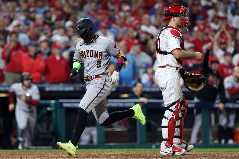 Oct 24, 2023; Philadelphia, Pennsylvania, USA; Arizona Diamondbacks shortstop Geraldo Perdomo (2) tags home plate to score a run against the Philadelphia Phillies in the seventh inning for game seven of the NLCS for the 2023 MLB playoffs at Citizens Bank Park. Mandatory Credit: Bill Streicher-USA TODAY Sports