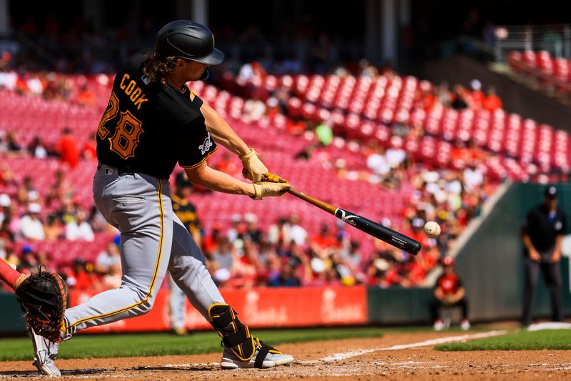 Sep 21, 2024; Cincinnati, Ohio, USA; Pittsburgh Pirates outfielder Billy Cook (28) hits a single in the seventh inning against the Cincinnati Reds at Great American Ball Park. Mandatory Credit: Katie Stratman-Imagn Images