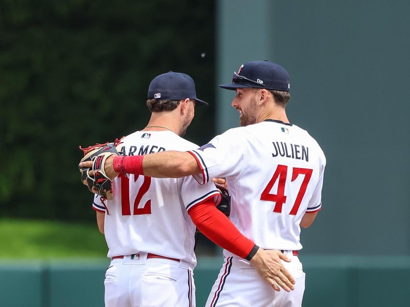 May 24, 2023; Minneapolis, Minnesota, USA; Minnesota Twins shortstop Kyle Farmer (12) and second baseman Edouard Julien (47) celebrate the win against the San Francisco Giants at Target Field. Mandatory Credit: Matt Krohn-USA TODAY Sports