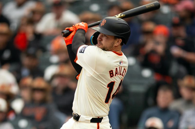 Jul 27, 2024; San Francisco, California, USA; San Francisco Giants catcher Patrick Bailey (14) follows through on his two-RBI double against the Colorado Rockies during the seventh inning at Oracle Park. Mandatory Credit: D. Ross Cameron-USA TODAY Sports