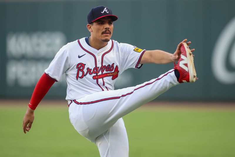 Jul 22, 2024; Atlanta, Georgia, USA; Atlanta Braves second baseman Nacho Alvarez Jr. (17) stretches before a game against the Cincinnati Reds at Truist Park. Mandatory Credit: Brett Davis-USA TODAY Sports
