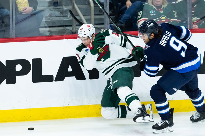 Feb 20, 2024; Winnipeg, Manitoba, CAN; Winnipeg Jets forward Alex Iafallo (9) Minnesota Wild forward Vinny Lettieri (10) during third period at Canada Life Centre. Mandatory Credit: Terrence Lee-USA TODAY Sports