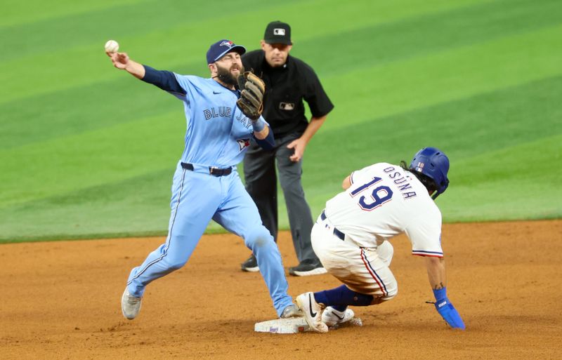May 28, 2025; Arlington, Texas, USA; Toronto Blue Jays second baseman Michael Stefanic (16) forces out Texas Rangers left fielder Alejandro Osuna (19) at second base during the seventh inning at Globe Life Field. Mandatory Credit: Kevin Jairaj-Imagn Images