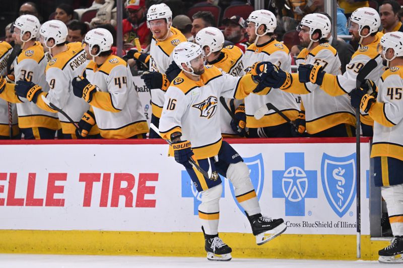 Apr 12, 2024; Chicago, Illinois, USA; Nashville Predators forward Jason Zucker (16) celebrates with the bench after scoring a goal in the second period against the Chicago Blackhawks at United Center. Mandatory Credit: Jamie Sabau-USA TODAY Sports