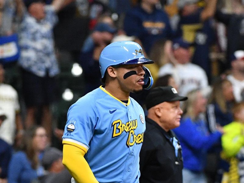 Sep 15, 2023; Milwaukee, Wisconsin, USA; Umpire Brian O'Nora (7) , Milwaukee Brewers catcher William Contreras (24) watches his home run travel over 450 feet against the Washington Nationals in the fifth inning at American Family Field. Mandatory Credit: Michael McLoone-USA TODAY Sports