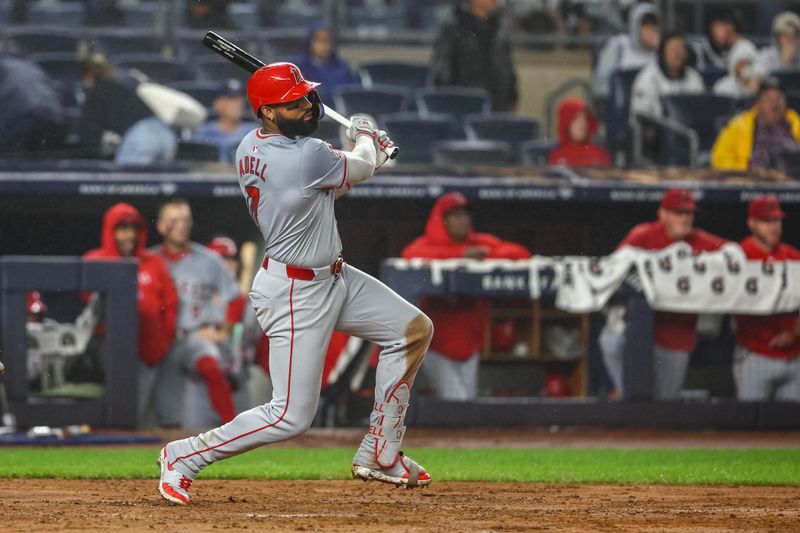 Aug 8, 2024; Bronx, New York, USA;  Los Angeles Angels right fielder Jo Adell (7) hits a three run double in the fifth inning against the New York Yankees at Yankee Stadium. Mandatory Credit: Wendell Cruz-USA TODAY Sports
