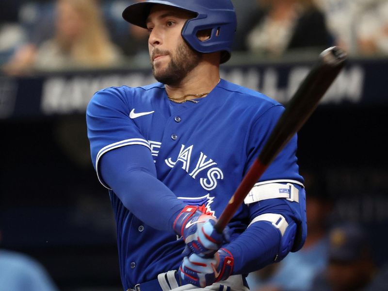 Mar 19, 2023; St. Petersburg, Florida, USA;  Toronto Blue Jays right fielder George Springer (4) singles against the Tampa Bay Rays during the fourth inning at Tropicana Field. Mandatory Credit: Kim Klement-USA TODAY Sports