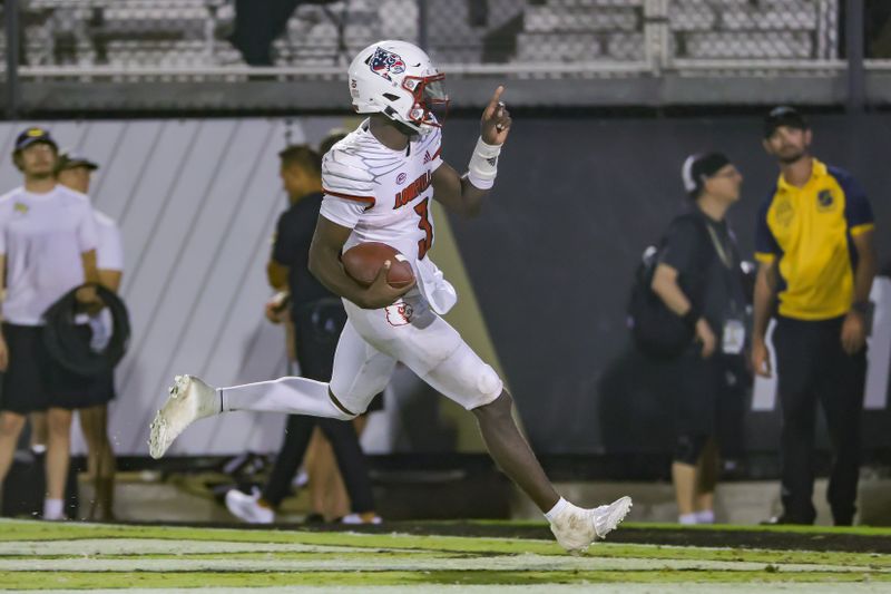 Sep 9, 2022; Orlando, Florida, USA; Louisville Cardinals quarterback Malik Cunningham (3) celebrates his touchdown during the second half against the UCF Knights at FBC Mortgage Stadium. Mandatory Credit: Mike Watters-USA TODAY Sports