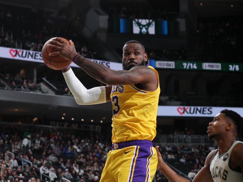 MILWAUKEE, WI - OCTOBER 10: LeBron James #23 of the Los Angeles Lakers rebound against the Milwaukee Bucks during a preseason game on October 10, 2024 at Fiserv Forum Center in Milwaukee, Wisconsin. NOTE TO USER: User expressly acknowledges and agrees that, by downloading and or using this Photograph, user is consenting to the terms and conditions of the Getty Images License Agreement. Mandatory Copyright Notice: Copyright 2024 NBAE (Photo by Gary Dineen/NBAE via Getty Images).