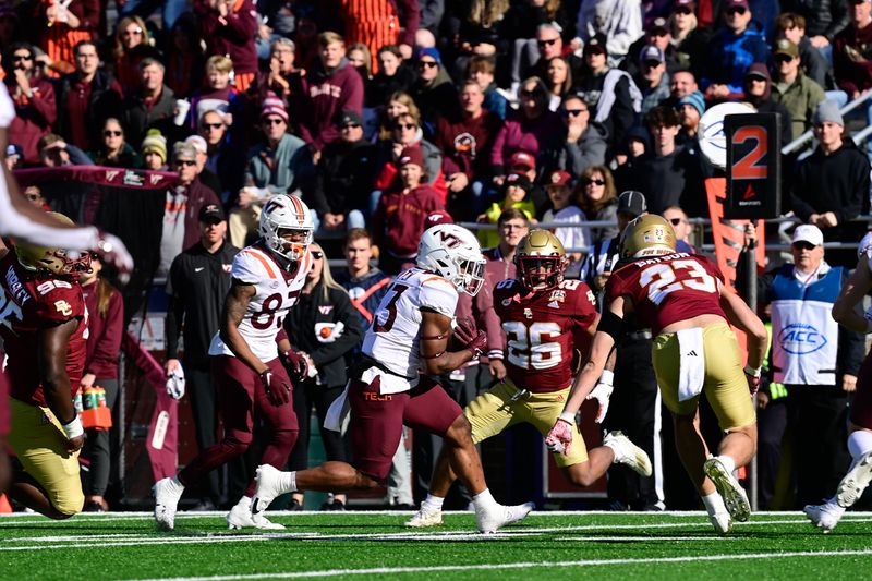 Nov 11, 2023; Chestnut Hill, Massachusetts, USA; Virginia Tech Hokies running back Bhayshul Tuten (33) runs the ball against the Boston College Eagles during the first half at Alumni Stadium. Mandatory Credit: Eric Canha-USA TODAY Sports