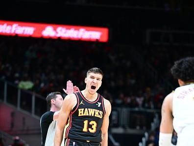 ATLANTA, GA - DECEMBER 11: Bogdan Bogdanovic #13 of the Atlanta Hawks celebrates during the game against the Denver Nuggets on December 11, 2023 at State Farm Arena in Atlanta, Georgia.  NOTE TO USER: User expressly acknowledges and agrees that, by downloading and/or using this Photograph, user is consenting to the terms and conditions of the Getty Images License Agreement. Mandatory Copyright Notice: Copyright 2023 NBAE (Photo by Adam Hagy/NBAE via Getty Images)