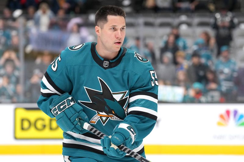 Mar 11, 2023; San Jose, California, USA; San Jose Sharks defenseman Derrick Pouliot (55) warms up before the game against the Minnesota Wild at SAP Center at San Jose. Mandatory Credit: Darren Yamashita-USA TODAY Sports