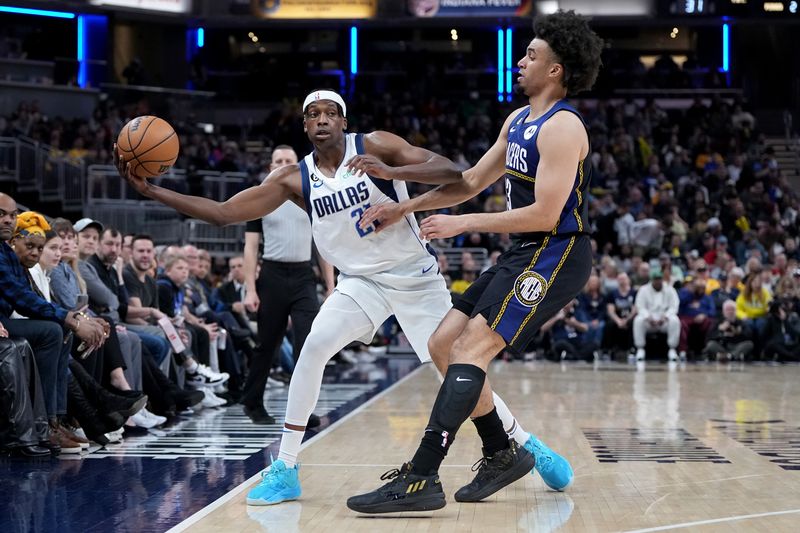 INDIANAPOLIS, INDIANA - MARCH 27: Frank Ntilikina #21 of the Dallas Mavericks handles the ball while being guarded by Jordan Nwora #13 of the Indiana Pacers in the second quarter at Gainbridge Fieldhouse on March 27, 2023 in Indianapolis, Indiana. NOTE TO USER: User expressly acknowledges and agrees that, by downloading and or using this photograph, User is consenting to the terms and conditions of the Getty Images License Agreement. (Photo by Dylan Buell/Getty Images)