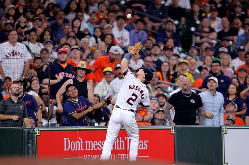 May 5, 2024; Houston, Texas, USA; Houston Astros third baseman Alex Bregman (2) catches a foul ball for an out against the Seattle Mariners during the third inning at Minute Maid Park. Mandatory Credit: Erik Williams-USA TODAY Sports