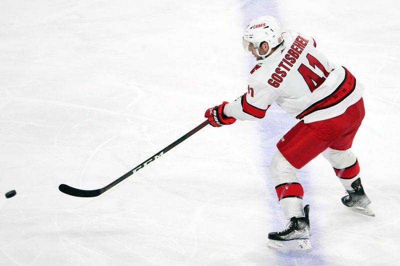 Mar 3, 2023; Tempe, Arizona, USA; Carolina Hurricanes defenseman Shayne Gostisbehere (41) shoots against the Arizona Coyotes during the third period at Mullett Arena. Mandatory Credit: Joe Camporeale-USA TODAY Sports