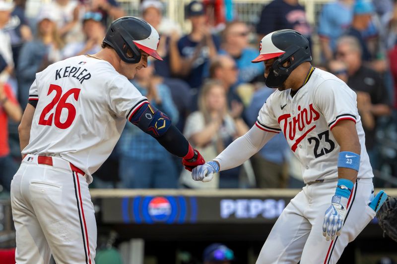 Jun 19, 2024; Minneapolis, Minnesota, USA; Minnesota Twins third baseman Royce Lewis (23) celebrates with right fielder Max Kepler (26) after hitting a solo home run against the Tampa Bay Rays in the fifth inning at Target Field. Mandatory Credit: Jesse Johnson-USA TODAY Sports