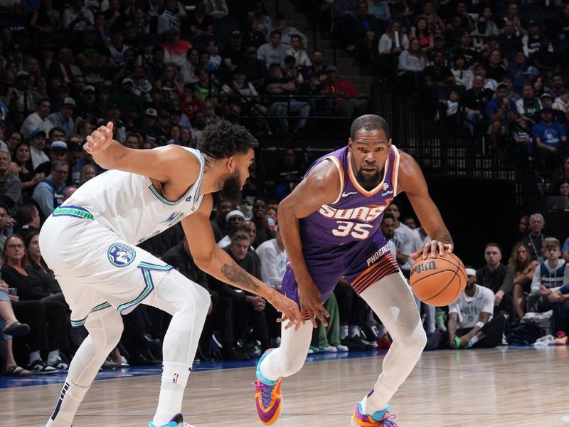 MINNEAPOLIS, MN -  APRIL 14: Kevin Durant #35 of the Phoenix Suns handles the ball during the game against the Minnesota Timberwolves on April 14, 2024 at Target Center in Minneapolis, Minnesota. NOTE TO USER: User expressly acknowledges and agrees that, by downloading and or using this Photograph, user is consenting to the terms and conditions of the Getty Images License Agreement. Mandatory Copyright Notice: Copyright 2024 NBAE (Photo by Jordan Johnson/NBAE via Getty Images)