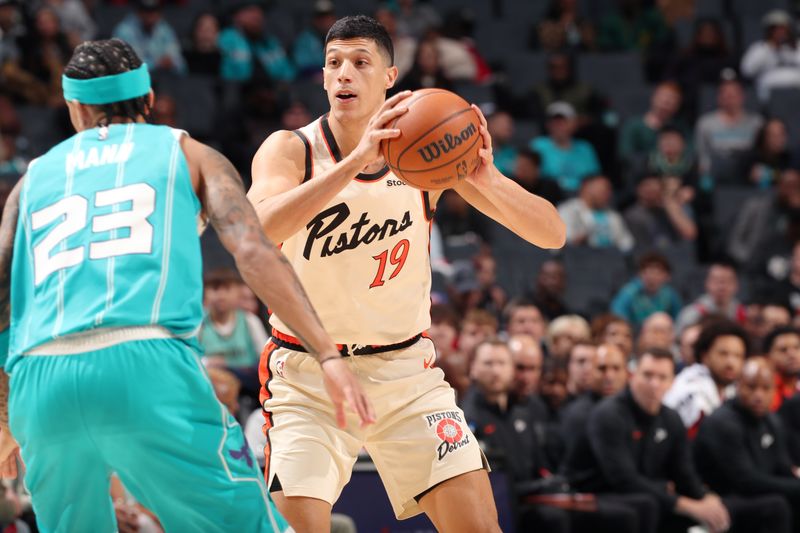 CHARLOTTE, NC - NOVEMBER 21: Simone Fontecchio #19 of the Detroit Pistons looks to pass the ball during the game against the Charlotte Hornets on November 21, 2024 at Spectrum Center in Charlotte, North Carolina. NOTE TO USER: User expressly acknowledges and agrees that, by downloading and or using this photograph, User is consenting to the terms and conditions of the Getty Images License Agreement. Mandatory Copyright Notice: Copyright 2024 NBAE (Photo by Kent Smith/NBAE via Getty Images)