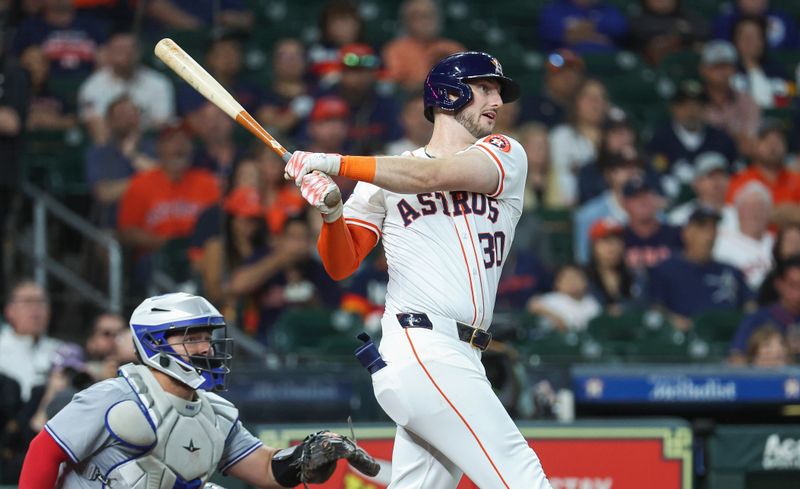 Apr 3, 2024; Houston, Texas, USA; Houston Astros right fielder Kyle Tucker (30) hits a single during the first inning against the Toronto Blue Jays at Minute Maid Park. Mandatory Credit: Troy Taormina-USA TODAY Sports