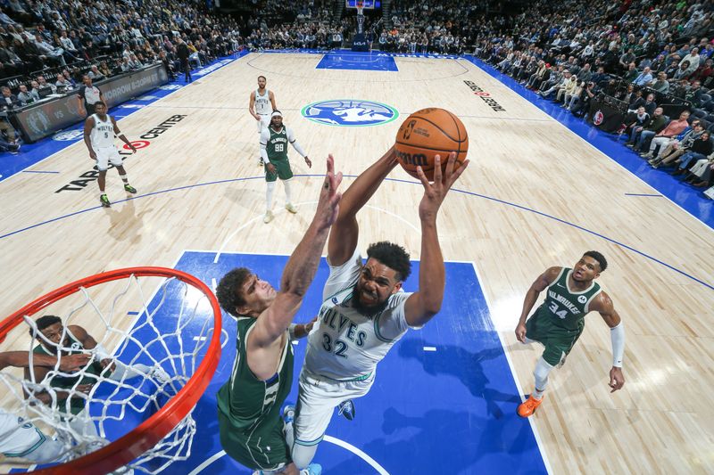 MINNEAPOLIS, MN -  FEBRUARY 23: Karl-Anthony Towns #32 of the Minnesota Timberwolves goes to the basket during the game on February 23, 2024 at Target Center in Minneapolis, Minnesota. NOTE TO USER: User expressly acknowledges and agrees that, by downloading and or using this Photograph, user is consenting to the terms and conditions of the Getty Images License Agreement. Mandatory Copyright Notice: Copyright 2024 NBAE (Photo by David Sherman/NBAE via Getty Images)