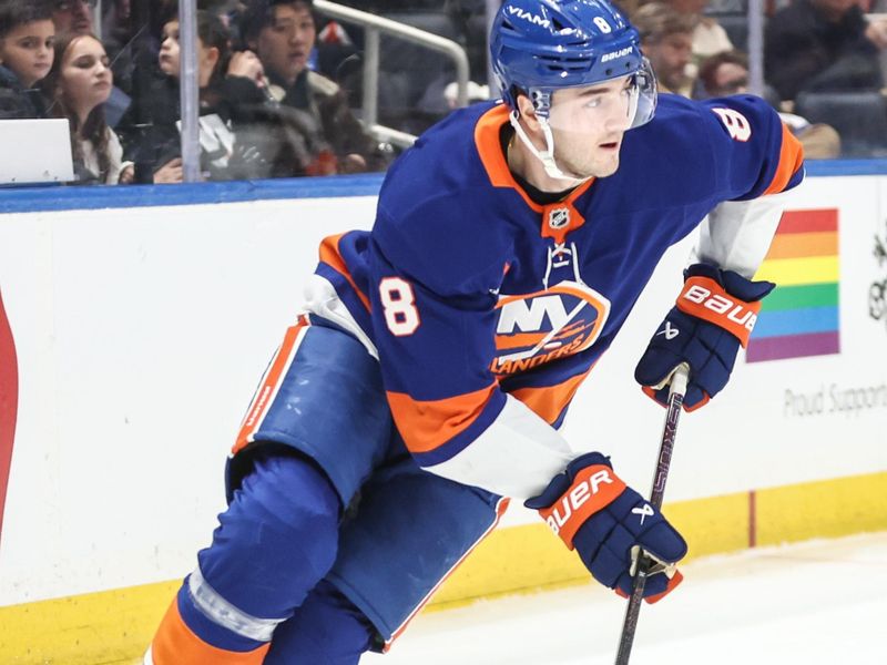 Jan 16, 2025; Elmont, New York, USA;  New York Islanders defenseman Noah Dobson (8) controls the puck in the first period against the Philadelphia Flyers at UBS Arena. Mandatory Credit: Wendell Cruz-Imagn Images