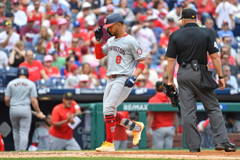 May 19, 2024; Philadelphia, Pennsylvania, USA; Washington Nationals outfielder Eddie Rosario (8) steps on home after hitting a two run home run against the Philadelphia Phillies during the fourth inning at Citizens Bank Park. Mandatory Credit: Eric Hartline-USA TODAY Sports