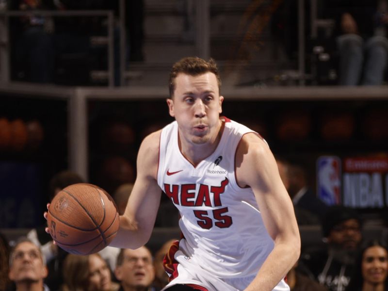 DETROIT, MI - NOOVEMBER 12:  Duncan Robinson #55 of the Miami Heat dribbles the ball during the game against the Detroit Pistons during the Emirates NBA Cup game on November 12, 2024 at Little Caesars Arena in Detroit, Michigan. NOTE TO USER: User expressly acknowledges and agrees that, by downloading and/or using this photograph, User is consenting to the terms and conditions of the Getty Images License Agreement. Mandatory Copyright Notice: Copyright 2024 NBAE (Photo by Brian Sevald/NBAE via Getty Images)