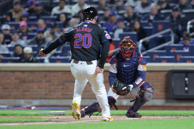 May 10, 2024; New York City, New York, USA; Atlanta Braves catcher Travis d'Arnaud (16) tags out New York Mets first baseman Pete Alonso (20) trying to score on a fielder's choice by Mets center fielder Harrison Bader (not pictured) during the second inning at Citi Field. Mandatory Credit: Brad Penner-USA TODAY Sports