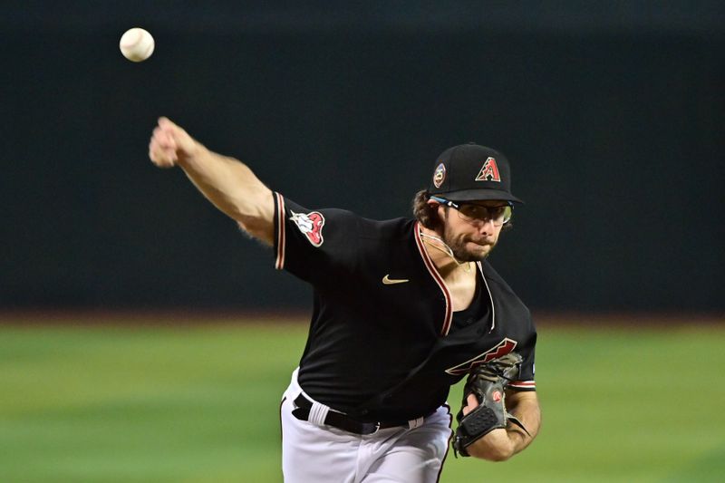 Jul 26, 2023; Phoenix, Arizona, USA;  Arizona Diamondbacks starting pitcher Zac Gallen (23) throws in the second inning against the St. Louis Cardinals at Chase Field. Mandatory Credit: Matt Kartozian-USA TODAY Sports