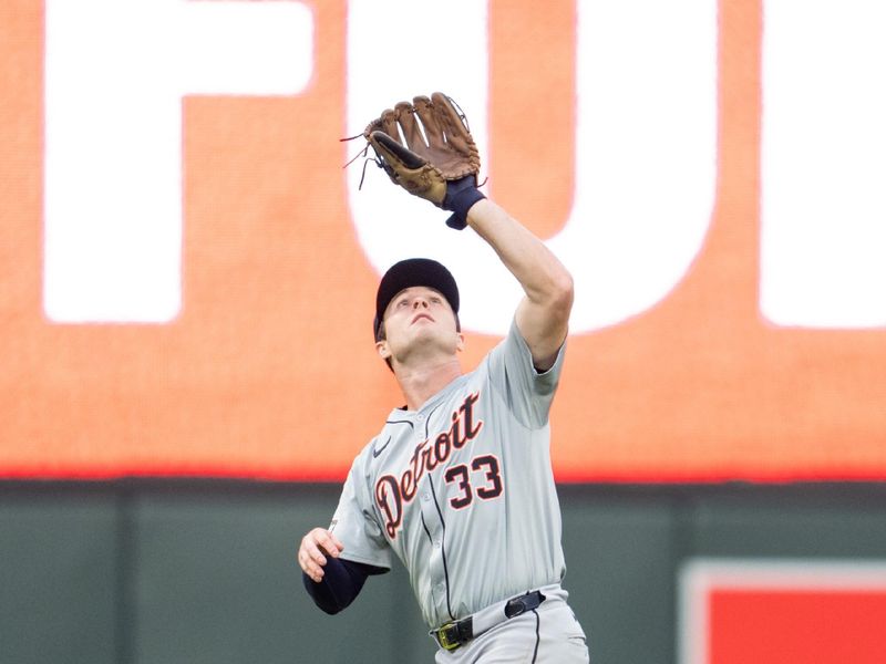 Jul 2, 2024; Minneapolis, Minnesota, USA; Detroit Tigers second base Colt Keith (33) catches a fly ball by 
Minnesota Twins second base Kyle Farmer (12) in the fifth inning at Target Field. Mandatory Credit: Matt Blewett-USA TODAY Sports