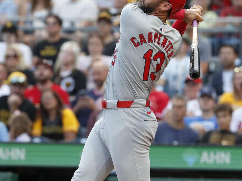 Jul 2, 2024; Pittsburgh, Pennsylvania, USA;  St. Louis Cardinals designated hitter Matt Carpenter (13) hits a single against the Pittsburgh Pirates during the fourth inning at PNC Park. Mandatory Credit: Charles LeClaire-USA TODAY Sports