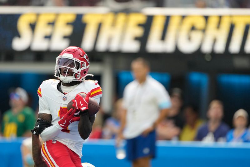 Kansas City Chiefs wide receiver Xavier Worthy catches a 54-yard touchdown pass during the first half of an NFL football game against the Los Angeles Chargers Sunday, Sept. 29, 2024, in Inglewood, Calif. (AP Photo/Ashley Landis)