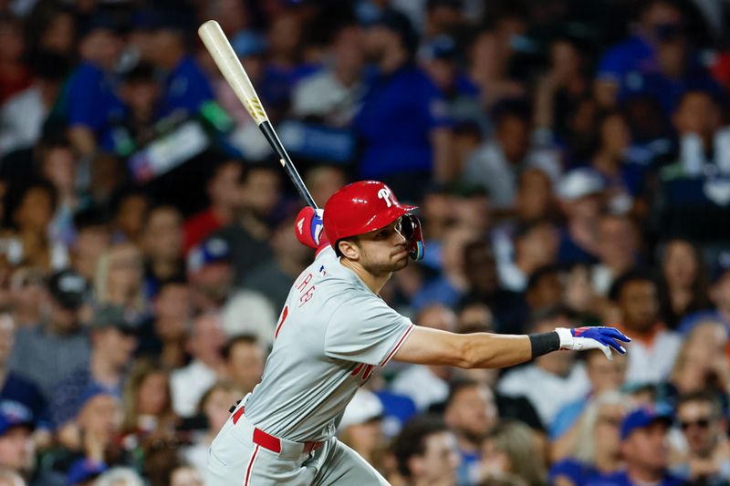 Jul 2, 2024; Chicago, Illinois, USA; Philadelphia Phillies shortstop Trea Turner (7) hits an RBI-single against the Chicago Cubs during the seventh inning at Wrigley Field. Mandatory Credit: Kamil Krzaczynski-USA TODAY Sports