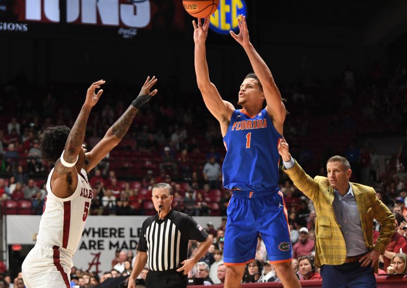 Feb 21, 2024; Tuscaloosa, Alabama, USA; Florida Gators guard Walter Clayton Jr. (1) shoots over Alabama Crimson Tide guard Aaron Estrada at Coleman Coliseum. Mandatory Credit: Gary Cosby Jr.-USA TODAY Sports