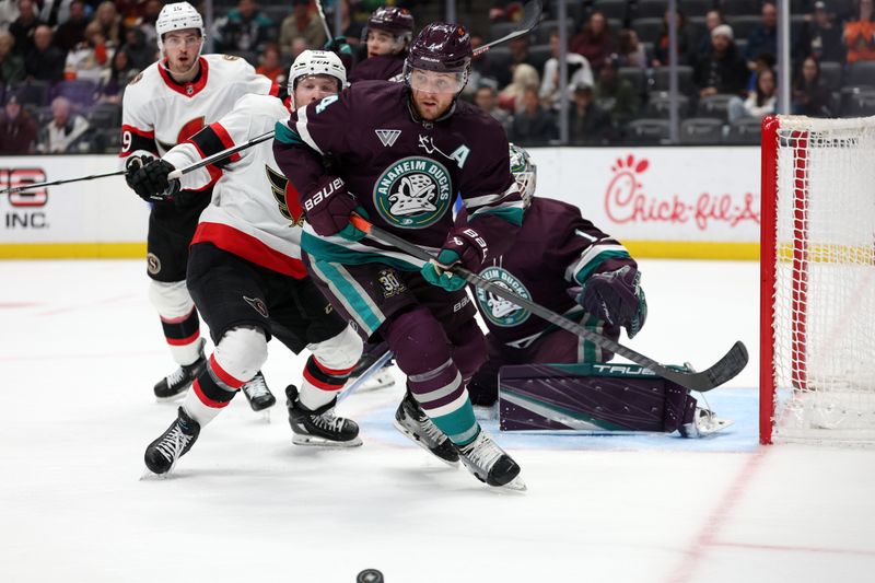 Mar 6, 2024; Anaheim, California, USA;  Anaheim Ducks defenseman Cam Fowler (4) chases the puck during the third period against the Ottawa Senators at Honda Center. Mandatory Credit: Kiyoshi Mio-USA TODAY Sports