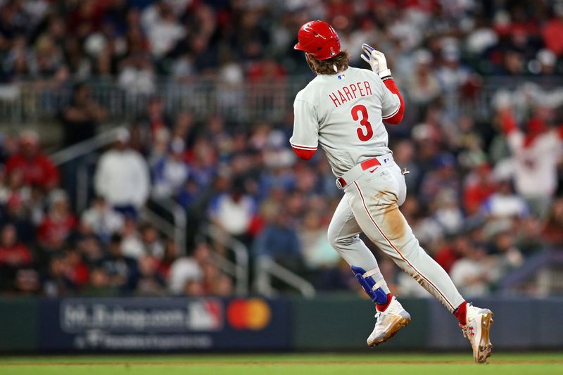 Oct 7, 2023; Cumberland, Georgia, USA; Philadelphia Phillies designated hitter Bryce Harper (3) celebrates after hitting a home run during the sixth inning against the Atlanta Braves during game one of the NLDS for the 2023 MLB playoffs at Truist Park. Mandatory Credit: Brett Davis-USA TODAY Sports