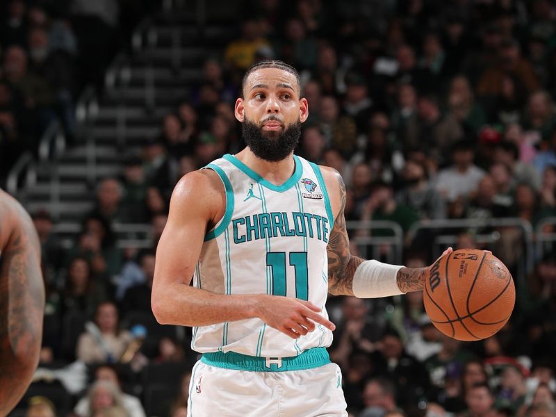 MILWAUKEE, WI - FEBRUARY 9: Cody Martin #11 of the Charlotte Hornets handles the ball during the game against the Milwaukee Bucks on February 9, 2024 at the Fiserv Forum Center in Milwaukee, Wisconsin. NOTE TO USER: User expressly acknowledges and agrees that, by downloading and or using this Photograph, user is consenting to the terms and conditions of the Getty Images License Agreement. Mandatory Copyright Notice: Copyright 2024 NBAE (Photo by Gary Dineen/NBAE via Getty Images).