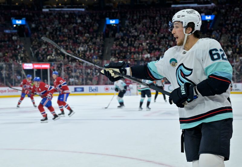 Oct 29, 2024; Montreal, Quebec, CAN; Seattle Kraken defenseman Brandon Montour (62) directs his teammates during the second period against the Montreal Canadiens at the Bell Centre. Mandatory Credit: Eric Bolte-Imagn Images