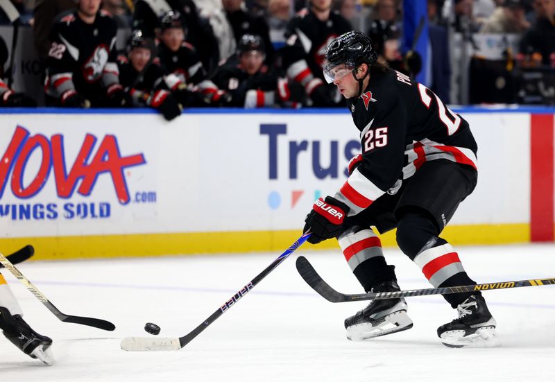 Dec 27, 2025; Buffalo, New York, USA;  Buffalo Sabres defenseman Owen Power (25) skates with the puck during the second period against the Boston Bruins at KeyBank Center. Mandatory Credit: Timothy T. Ludwig-Imagn Images