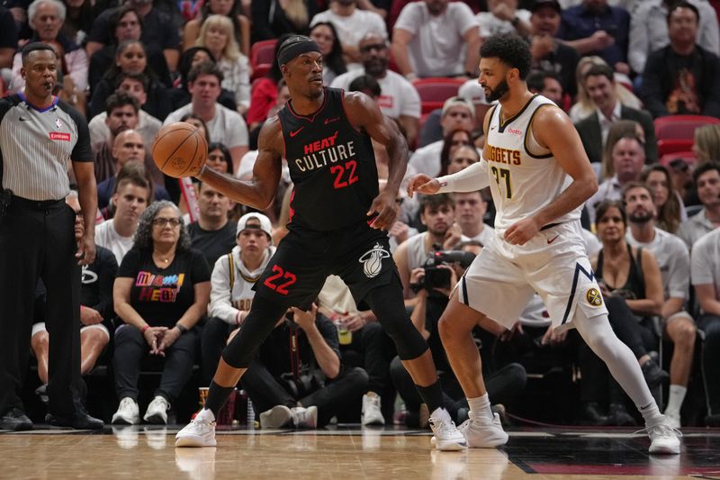 MIAMI, FL - MARCH 13: Jimmy Butler #22 of the Miami Heat handles the ball during the game against the Denver Nuggets on March 13, 2024 at Kaseya Center in Miami, Florida. NOTE TO USER: User expressly acknowledges and agrees that, by downloading and or using this Photograph, user is consenting to the terms and conditions of the Getty Images License Agreement. Mandatory Copyright Notice: Copyright 2024 NBAE (Photo by Eric Espada/NBAE via Getty Images)