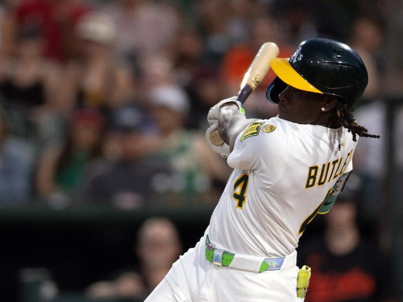 Jun 6, 2025; West Sacramento, California, USA; Athletics right fielder Lawrence Butler (4) follows through on his single against the Baltimore Orioles during the fifth inning at Sutter Health Park. Mandatory Credit: D. Ross Cameron-Imagn Images