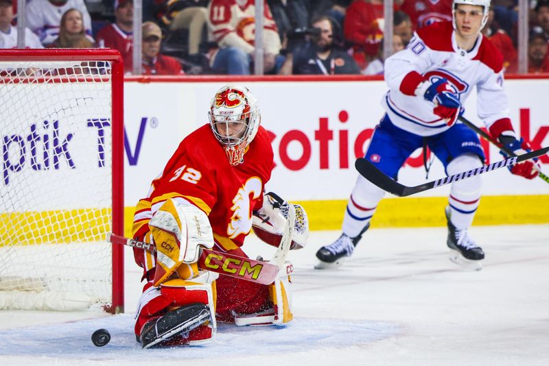 Mar 16, 2024; Calgary, Alberta, CAN; Calgary Flames goaltender Dustin Wolf (32) makes a save against the Montreal Canadiens during the third period at Scotiabank Saddledome. Mandatory Credit: Sergei Belski-USA TODAY Sports