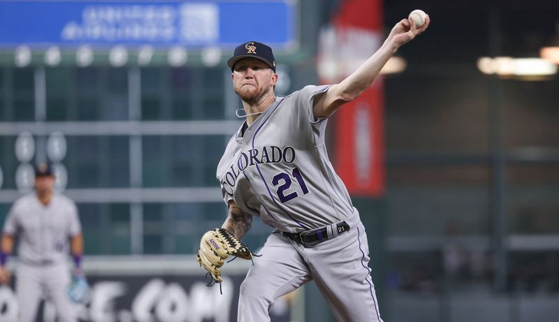 Jul 4, 2023; Houston, Texas, USA; Colorado Rockies starting pitcher Kyle Freeland (21) delivers a pitch during the fifth inning against the Houston Astros at Minute Maid Park. Mandatory Credit: Troy Taormina-USA TODAY Sports