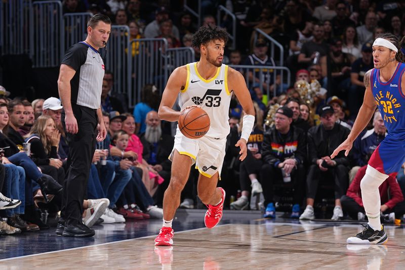 DENVER, CO - NOVEMBER 2: Johnny Juzang #33 of the Utah Jazz dribbles the ball during the game against the Denver Nuggets  during a regular season game on November 22, 2024 at Ball Arena in Denver, Colorado. NOTE TO USER: User expressly acknowledges and agrees that, by downloading and/or using this Photograph, user is consenting to the terms and conditions of the Getty Images License Agreement. Mandatory Copyright Notice: Copyright 2024 NBAE (Photo by Bart Young/NBAE via Getty Images)