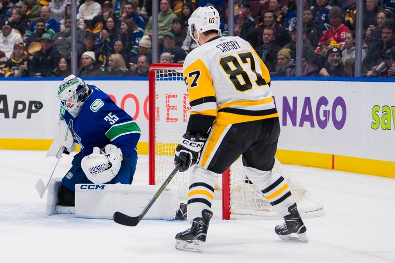 Feb 27, 2024; Vancouver, British Columbia, CAN; Pittsburgh Penguins forward Sidney Crosby (87) watches as Vancouver Canucks goalie Thatcher Demko (35) makes a save in the second period at Rogers Arena. Mandatory Credit: Bob Frid-USA TODAY Sports