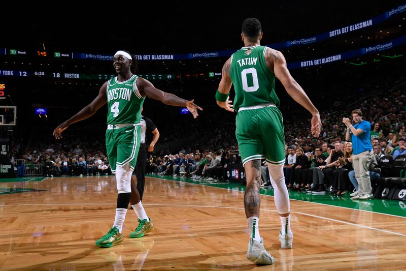 BOSTON, MA - OCTOBER 22: Jrue Holiday #4 and Jayson Tatum #0 of the Boston Celtics high five during the game against the New York Knicks on October 22, 2024 at TD Garden in Boston, Massachusetts. NOTE TO USER: User expressly acknowledges and agrees that, by downloading and/or using this Photograph, user is consenting to the terms and conditions of the Getty Images License Agreement. Mandatory Copyright Notice: Copyright 2024 NBAE (Photo by Brian Babineau/NBAE via Getty Images)