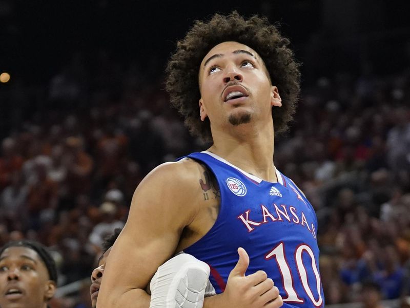 Mar 4, 2023; Austin, Texas, USA; Kansas Jayhawks forward Jalen Wilson (10) wraps up Texas Longhorns guard Tyrese Hunter (4) while waiting for a rebound during the second half at Moody Center. Mandatory Credit: Scott Wachter-USA TODAY Sports