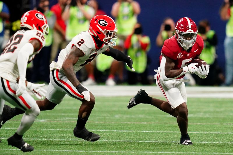 Dec 2, 2023; Atlanta, GA, USA; Alabama Crimson Tide running back Roydell Williams (5) runs against the Georgia Bulldogs in the first quarter of the SEC Championship at Mercedes-Benz Stadium. Mandatory Credit: John David Mercer-USA TODAY Sports