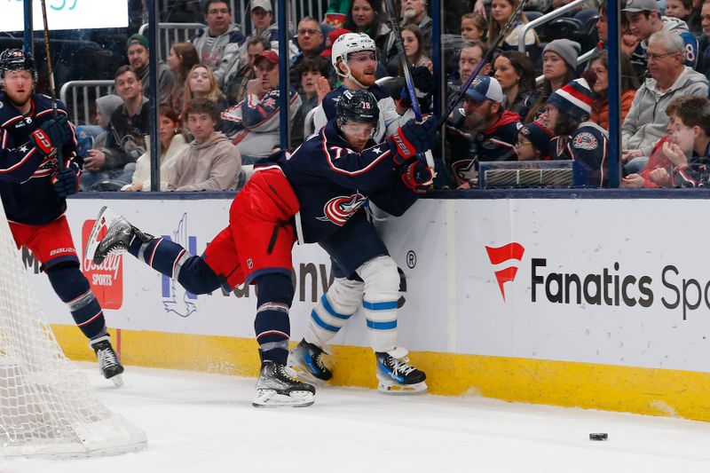 Mar 17, 2024; Columbus, Ohio, USA; Columbus Blue Jackets defenseman Damon Severson (78) checks Winnipeg Jets left wing Kyle Connor (81) during the first period at Nationwide Arena. Mandatory Credit: Russell LaBounty-USA TODAY Sports